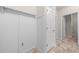 Hallway featuring white wainscoting and access to other rooms at 5048 Sw 57Th Pl, Ocala, FL 34474