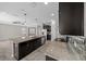 This open kitchen includes a large island, modern appliances, and dark wood cabinetry at 5048 Sw 57Th Pl, Ocala, FL 34474