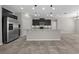 Charming kitchen with stainless steel appliances, gray cabinets, pendant lighting, and tiled flooring at 5048 Sw 57Th Pl, Ocala, FL 34474