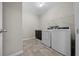 Laundry room with washer, dryer and storage cabinet at 5048 Sw 57Th Pl, Ocala, FL 34474