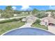 Inviting home with a well-maintained lawn, a two-car garage, and a circular driveway on a cul-de-sac at 6 Diamond Cove Ct, Ocala, FL 34472