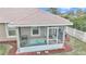 Beautiful fenced backyard showcasing a screened patio and a well-manicured lawn at 6 Diamond Cove Ct, Ocala, FL 34472