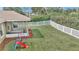 Spacious backyard with well-maintained lawn and enclosed patio area, perfect for outdoor activities at 6 Diamond Cove Ct, Ocala, FL 34472