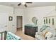 Bright bedroom featuring a ceiling fan, neutral walls, and a cozy sitting area at 6 Diamond Cove Ct, Ocala, FL 34472