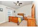 Cozy bedroom featuring a ceiling fan and neutral walls at 6 Diamond Cove Ct, Ocala, FL 34472