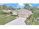 Beautiful one-story home with a two-car garage and an expansive driveway in a well-maintained neighborhood at 6 Diamond Cove Ct, Ocala, FL 34472