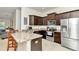 Modern kitchen features dark cabinets, stainless steel appliances, and granite countertops at 6 Diamond Cove Ct, Ocala, FL 34472