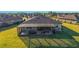 An aerial view of the home’s backyard and screened patio at 6558 Sw 94Th Cir, Ocala, FL 34481