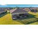 An aerial view of the home highlights the spacious backyard with a screened patio at 6558 Sw 94Th Cir, Ocala, FL 34481