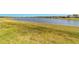 Scenic view of the backyard extending to a serene lake at 6558 Sw 94Th Cir, Ocala, FL 34481