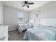 Bedroom with twin beds, carpet, and a ceiling fan at 6558 Sw 94Th Cir, Ocala, FL 34481