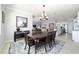View of dining room, with an area rug, chandelier, and open concept to kitchen, perfect for entertaining at 6558 Sw 94Th Cir, Ocala, FL 34481