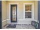 Elegant front door featuring decorative glass and sidelight, inviting guests into the home at 6558 Sw 94Th Cir, Ocala, FL 34481