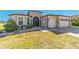Charming single-story home featuring a well-maintained lawn, manicured shrubs, and a two-car garage at 6558 Sw 94Th Cir, Ocala, FL 34481