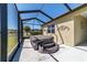 Outdoor hot tub with steps, providing relaxation in a screened lanai setting at 6558 Sw 94Th Cir, Ocala, FL 34481