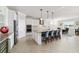Spacious kitchen with a large island, granite countertops, stainless steel appliances, and pendant lighting at 6558 Sw 94Th Cir, Ocala, FL 34481