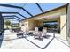 Spacious screened lanai with ample seating and a hot tub perfect for outdoor living at 6558 Sw 94Th Cir, Ocala, FL 34481
