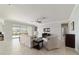 Spacious living room with a ceiling fan that extends to the outdoor patio through sliding glass doors at 6558 Sw 94Th Cir, Ocala, FL 34481