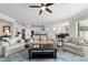 Open concept living room with modern decor flowing into the kitchen and dining area at 6558 Sw 94Th Cir, Ocala, FL 34481