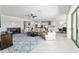 Bright, open living room with elegant decor, connects seamlessly to the kitchen and dining space at 6558 Sw 94Th Cir, Ocala, FL 34481