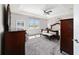 This main bedroom features a tray ceiling, a ceiling fan, and beautiful furniture at 6558 Sw 94Th Cir, Ocala, FL 34481