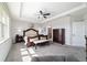 A view of the main bedroom suite with a sitting area and large windows at 6558 Sw 94Th Cir, Ocala, FL 34481