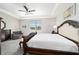 This bedroom includes a sitting area, large windows, and elegant decorations at 6558 Sw 94Th Cir, Ocala, FL 34481