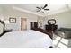 The main bedroom features a bed, walk-in closet and an ensuite bathroom at 6558 Sw 94Th Cir, Ocala, FL 34481