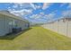 Large, fenced backyard providing a safe and expansive outdoor area at 6933 Se 111Th Ln, Belleview, FL 34420