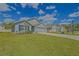 Well-maintained single-story home with a green lawn and inviting curb appeal at 6933 Se 111Th Ln, Belleview, FL 34420