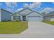 Charming single-story home with a well-manicured lawn and a two-car garage at 6933 Se 111Th Ln, Belleview, FL 34420