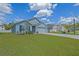 Pleasant one-story residence showcasing an expansive lawn and convenient driveway access at 6933 Se 111Th Ln, Belleview, FL 34420