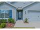 Beautiful home exterior featuring manicured landscaping and inviting entry at 6933 Se 111Th Ln, Belleview, FL 34420