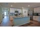 A kitchen features stainless steel appliances, granite countertops, and custom cabinets at 6933 Se 111Th Ln, Belleview, FL 34420