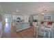A kitchen has granite countertops and is open to a dining area with seating for six at 6933 Se 111Th Ln, Belleview, FL 34420