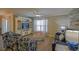 A living room includes hardwood floors, ceiling fan, and a decorative cabinet at 6933 Se 111Th Ln, Belleview, FL 34420
