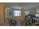 A living room includes hardwood floors, ceiling fan, and a decorative cabinet at 6933 Se 111Th Ln, Belleview, FL 34420