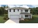 Charming two-story home with a well-manicured front yard and attached two-car garage at 7109 Se 113Th Ln, Belleview, FL 34420