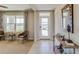 Inviting home foyer with neutral tones, tile entry, and natural light from the front door window at 7109 Se 113Th Ln, Belleview, FL 34420