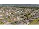 Expansive aerial view of a well-maintained neighborhood, featuring lush greenery and neatly arranged homes at 7283 Sw 94Th Ave, Ocala, FL 34481