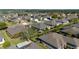 Overhead view of homes in a residential area with lush greenery, well-maintained lawns, and a sense of community at 7283 Sw 94Th Ave, Ocala, FL 34481
