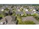 Aerial shot of cozy homes with manicured yards in a peaceful neighborhood, showcasing privacy fences at 7283 Sw 94Th Ave, Ocala, FL 34481