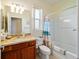 Bathroom featuring a vanity with a granite countertop, a toilet, and a shower with a tub at 7283 Sw 94Th Ave, Ocala, FL 34481
