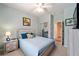 Comfortable bedroom with a ceiling fan, mirror closet doors, and light blue walls at 7283 Sw 94Th Ave, Ocala, FL 34481