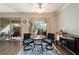 Comfortable dining area with sliding glass doors to the lanai, stylish rug, and sideboard for additional storage at 7283 Sw 94Th Ave, Ocala, FL 34481