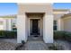 Inviting home entrance with stately white columns and manicured shrubbery at 7283 Sw 94Th Ave, Ocala, FL 34481