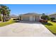 Attractive one-story home with a large driveway featuring a custom geometric design at 7283 Sw 94Th Ave, Ocala, FL 34481