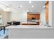 Stylish kitchen featuring stainless steel appliances, wood cabinets, an island, and a breakfast nook area at 7283 Sw 94Th Ave, Ocala, FL 34481