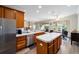 Bright kitchen features stainless steel appliances, ample counter space, wood cabinets, and backyard views at 7283 Sw 94Th Ave, Ocala, FL 34481