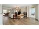 Cozy living room with hardwood floors, comfortable furniture, a ceiling fan, and easy access to other rooms at 7283 Sw 94Th Ave, Ocala, FL 34481